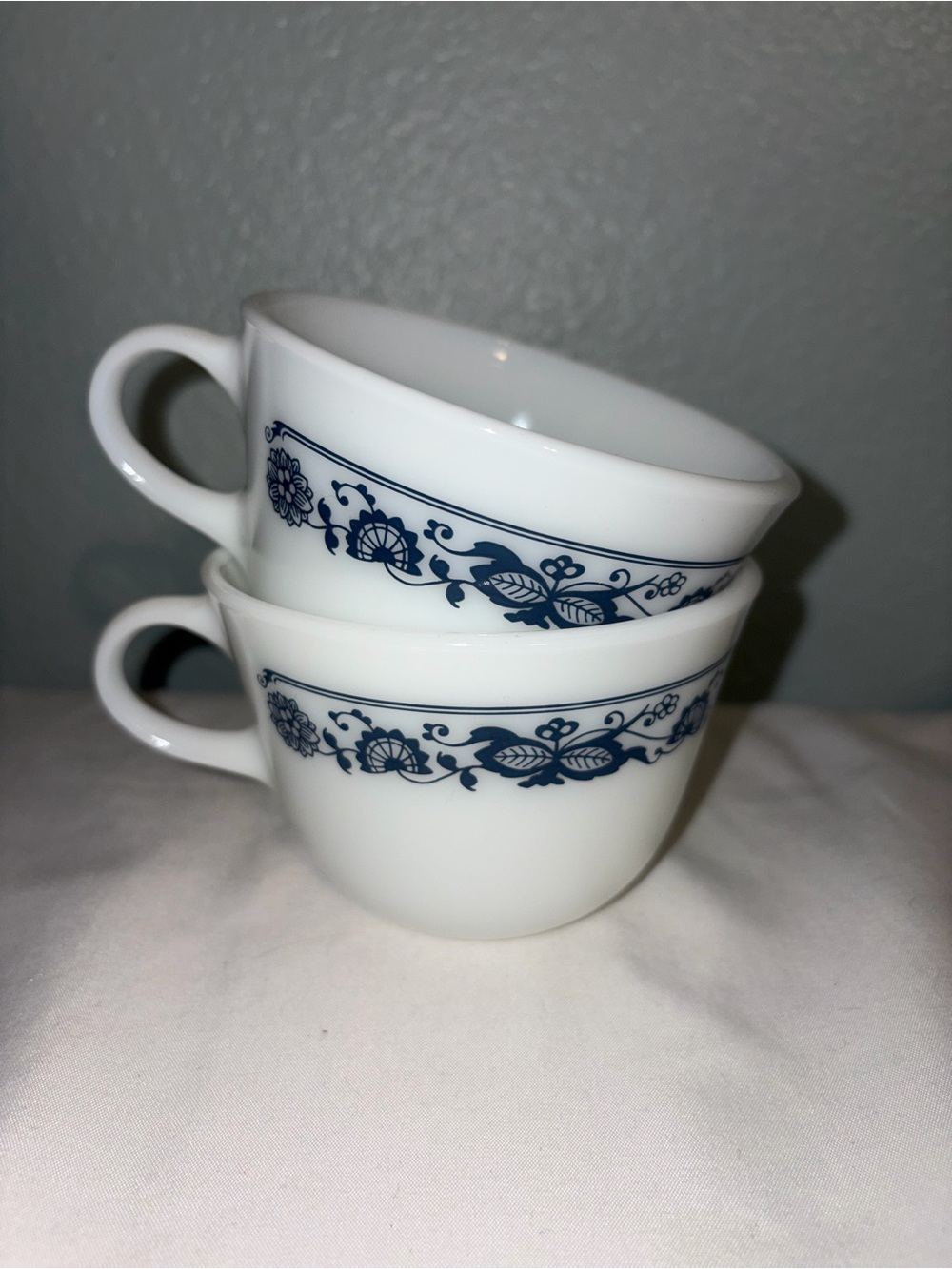 vintage Pyrex milk glass coffee cups in the Old Town Blue pattern.